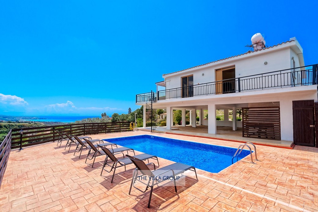 Sunbeds surrounding the swimming pool set the scene for relaxing under the Cyprus sunshine