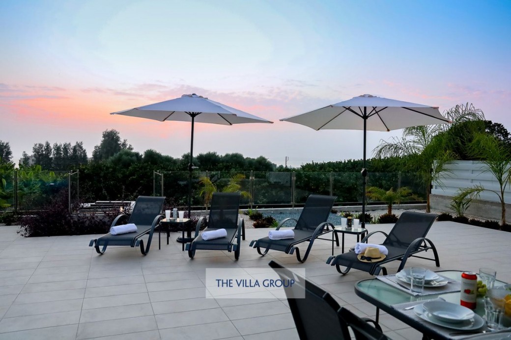 Outdoor area with sunbeds and umbrellas