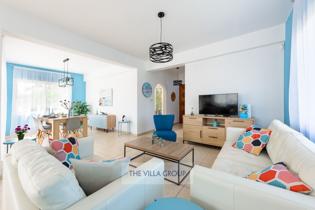 The living room opens through to a superbly equipped kitchen 