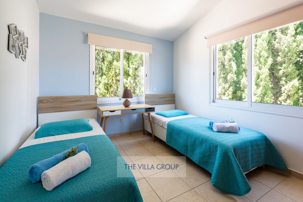 The second and third bedrooms are furnished with 2 single beds each with a dedicated bathroom serving both rooms