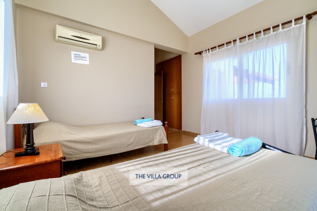 Twin bedroom with ample storage space