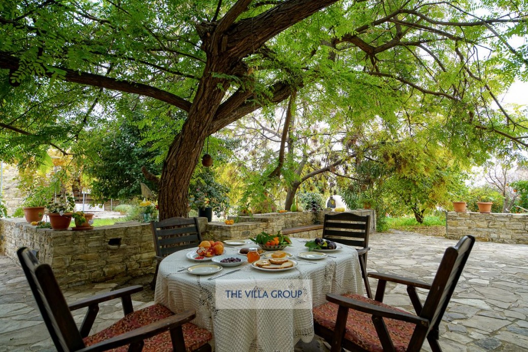 The beautiful courtyard with plenty of seating areas is surrounded by the orchard 
