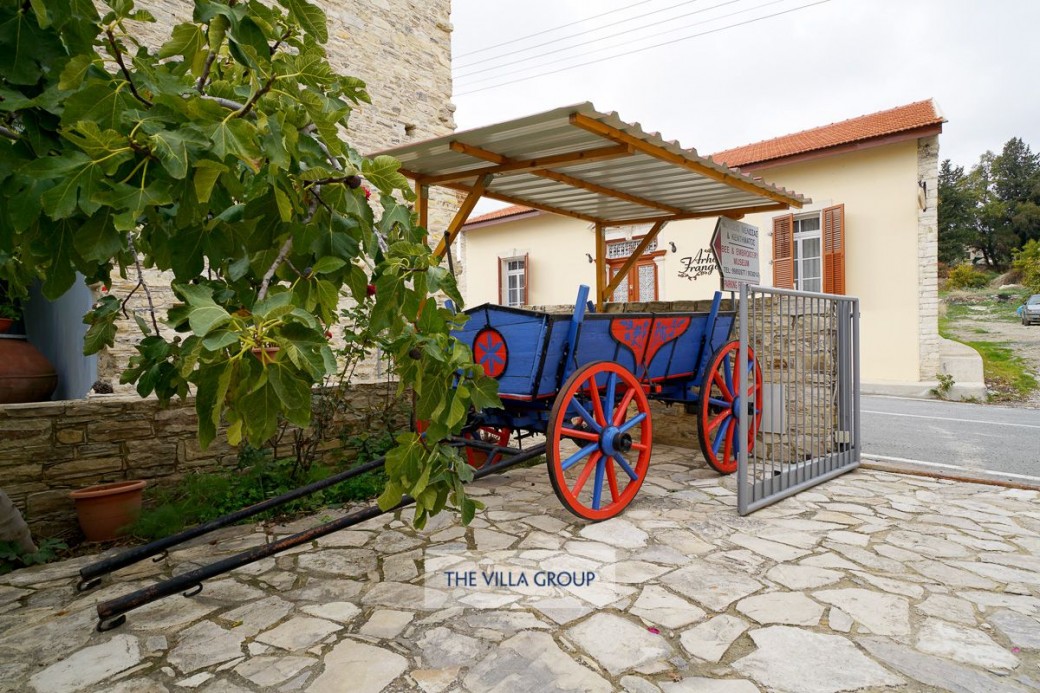 Private parking to the side of the property with traditional horse cart