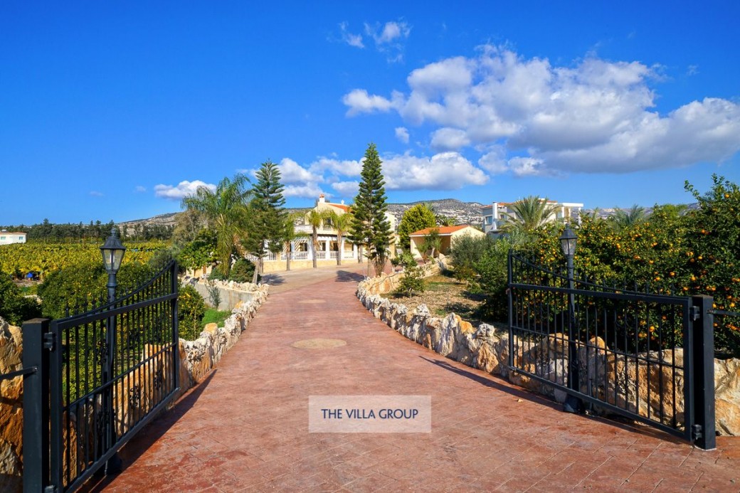 Gated driveway leading to the villa