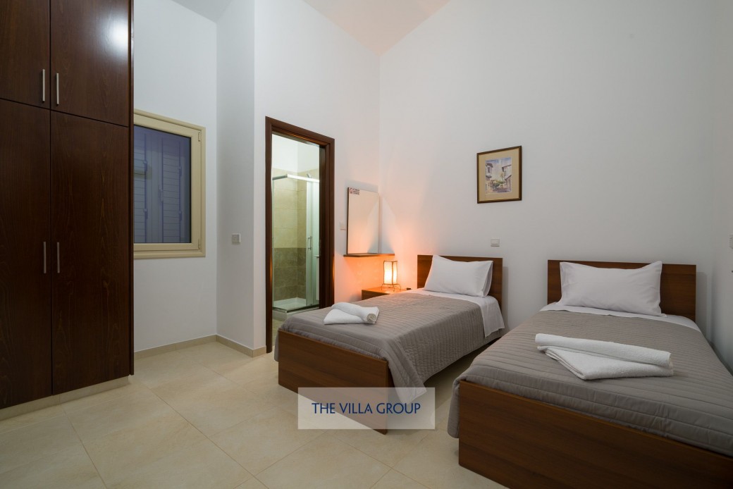 Twin bedroom during the evening