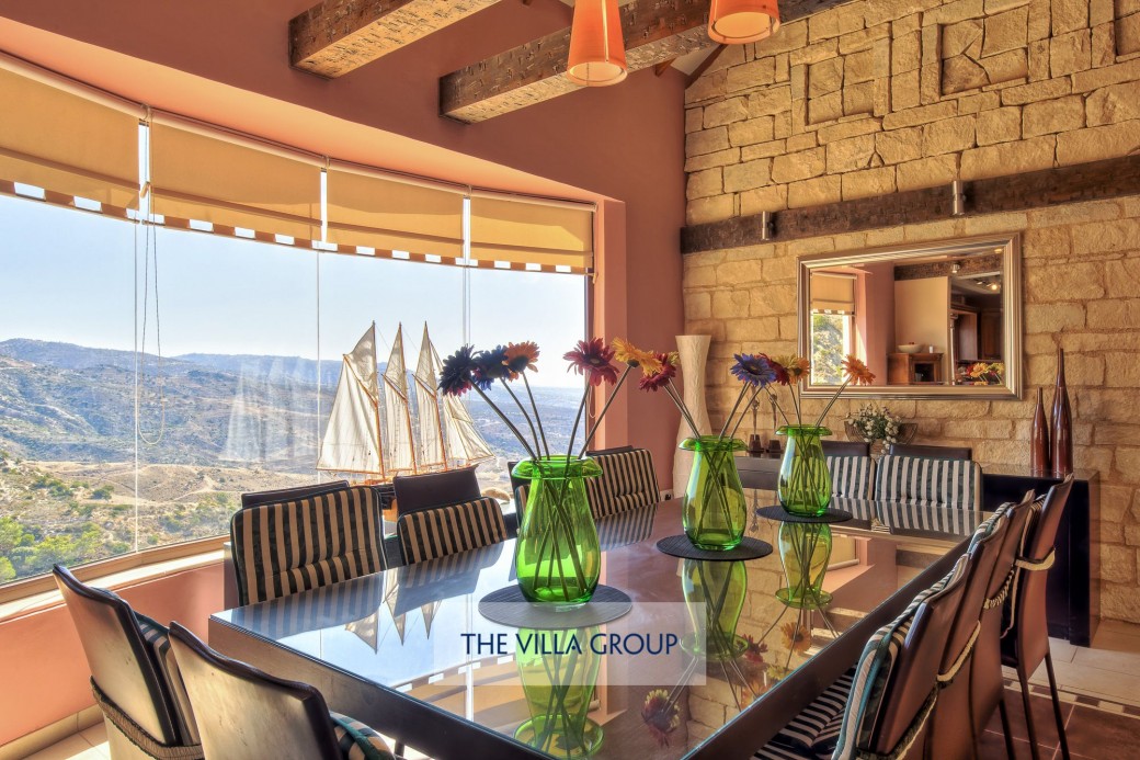 Dining table with a prime position next to the large picture window with views across the valley