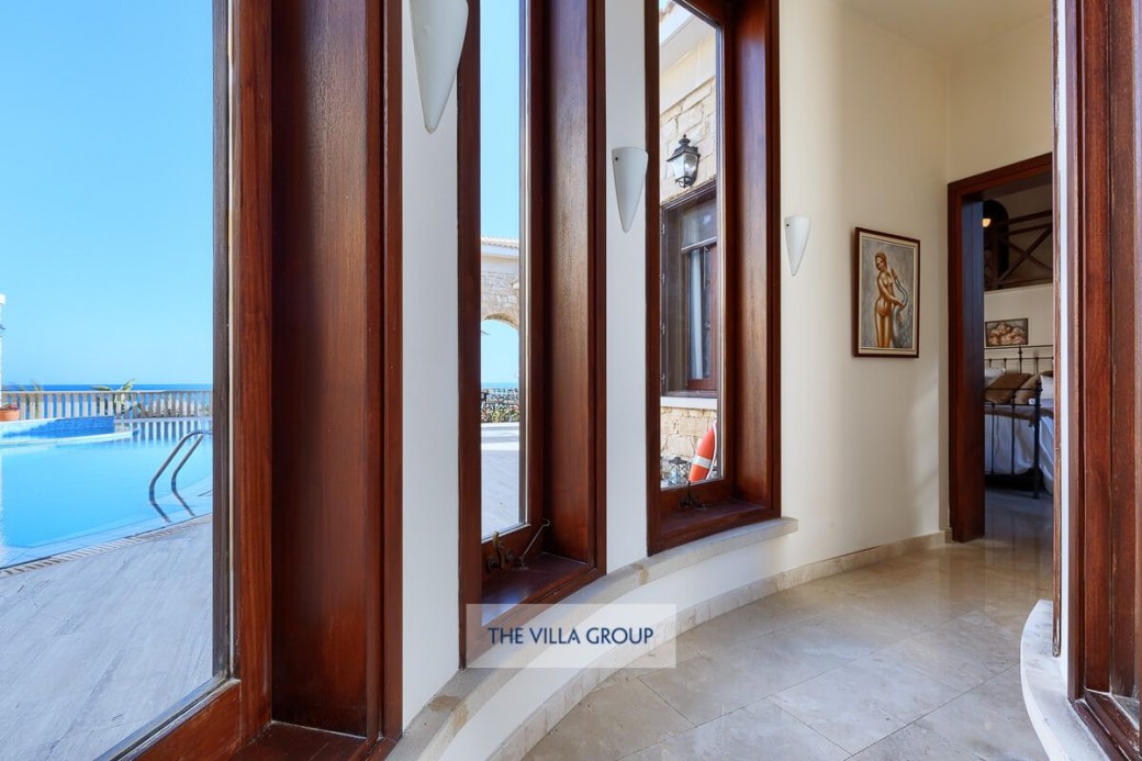 Impressive floor to ceiling glass hallway from the main living room