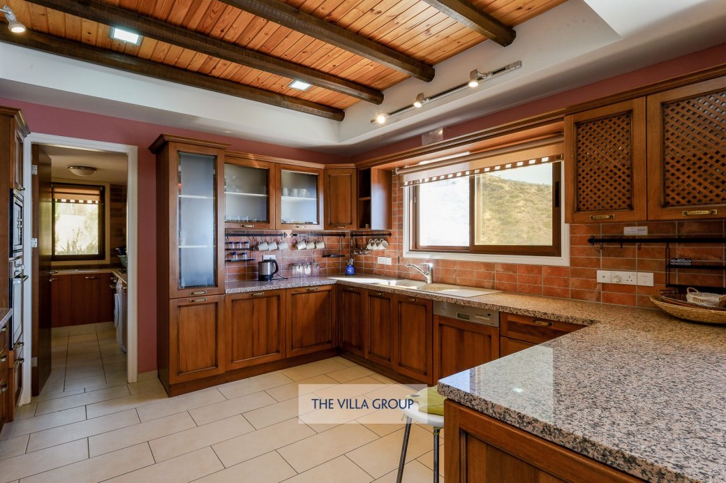 The spacious kitchen is fully equipped