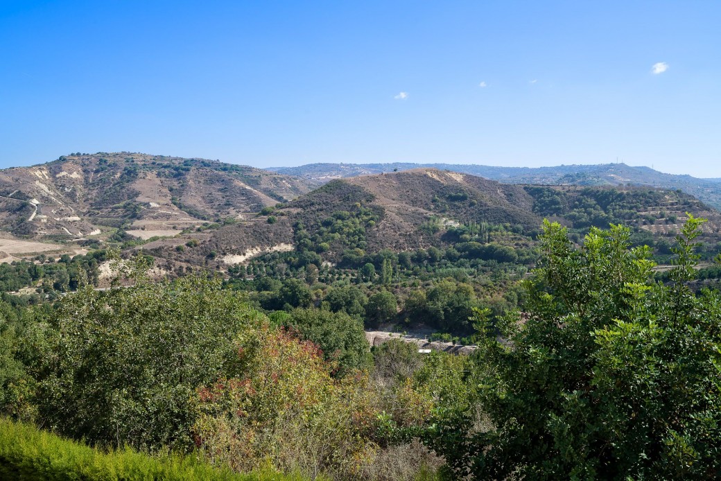 Views over orchards, open countryside and distant mountains