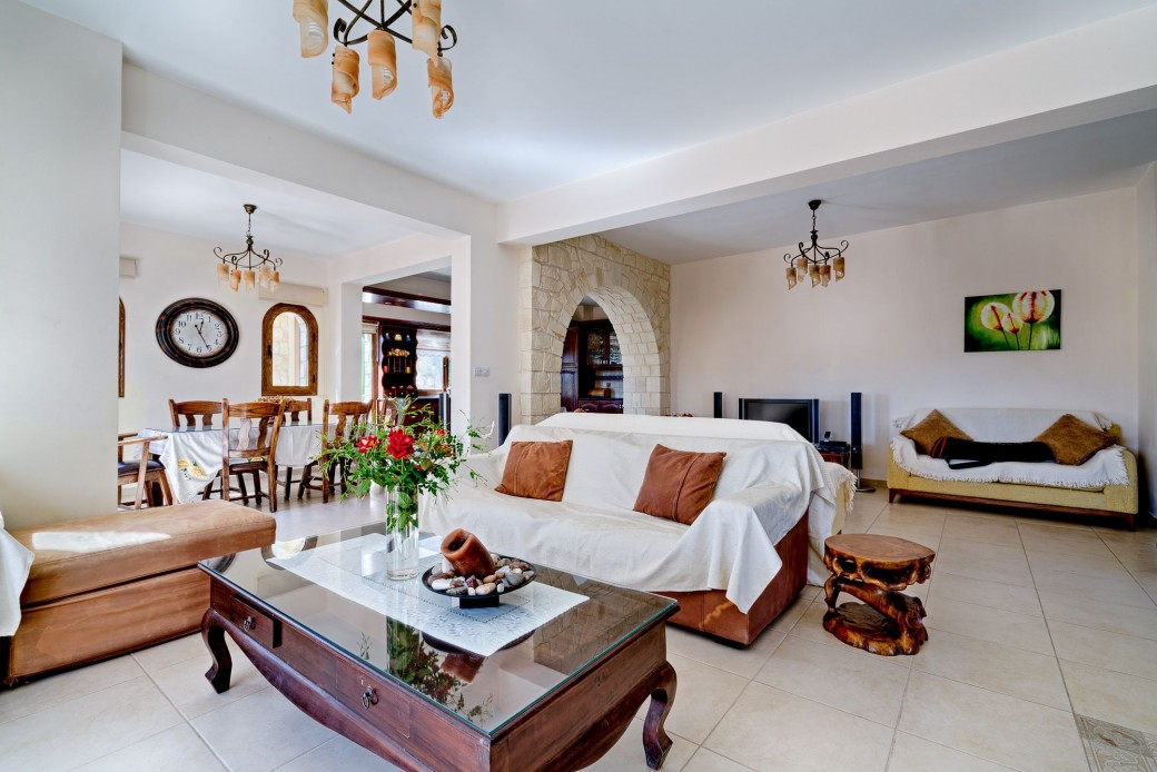 Living area featuring comfortable sofas, flat-screen TV with an Android box, a DVD player