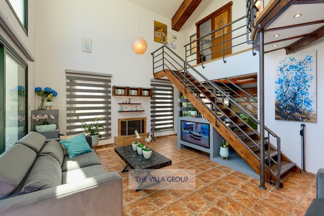 Living area, stairs leading to first floor