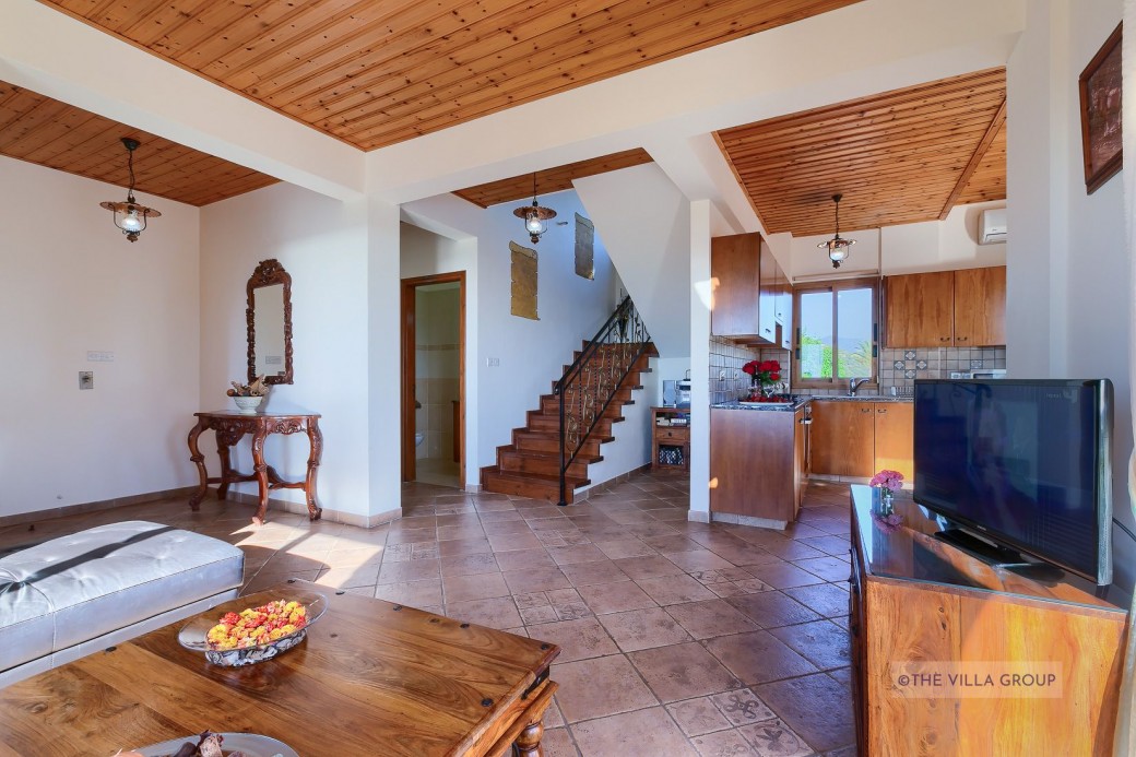 Terracotta floor tiles and rustic beamed ceilings