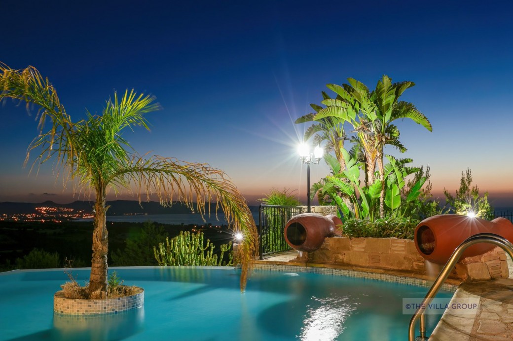 Outside is a large traditional style stone built barbecue and a traditional clay oven