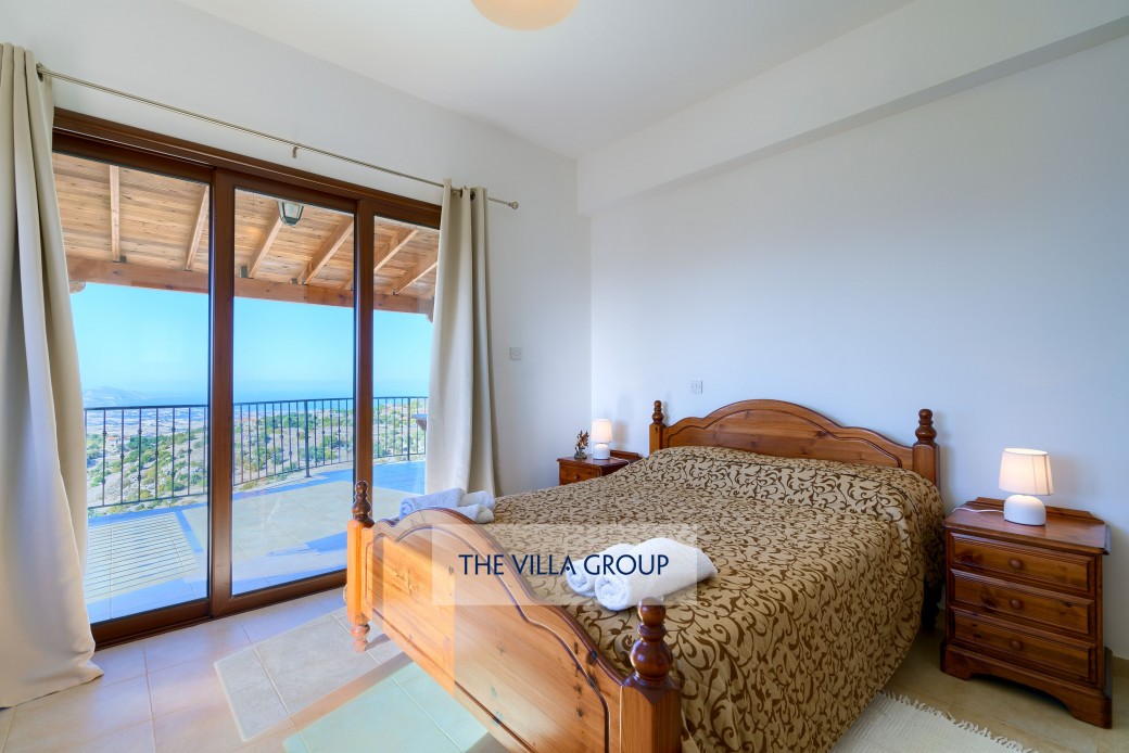 Double bedroom with access to shared balcony offering stunning views