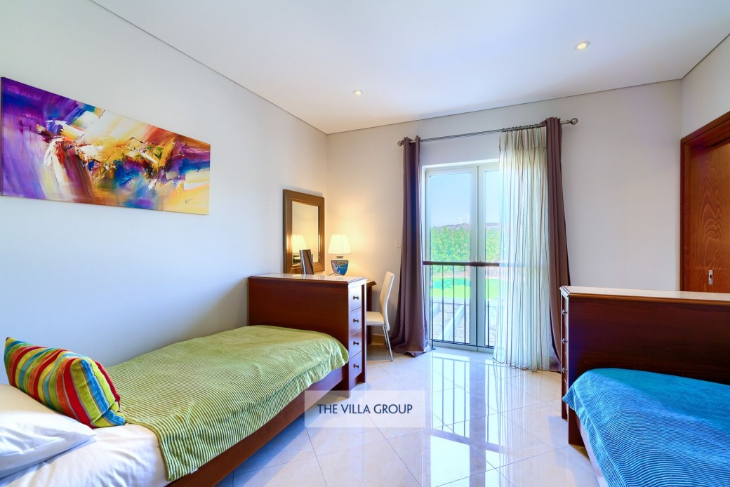 Twin bedroom with inter-connecting door to double bedroom