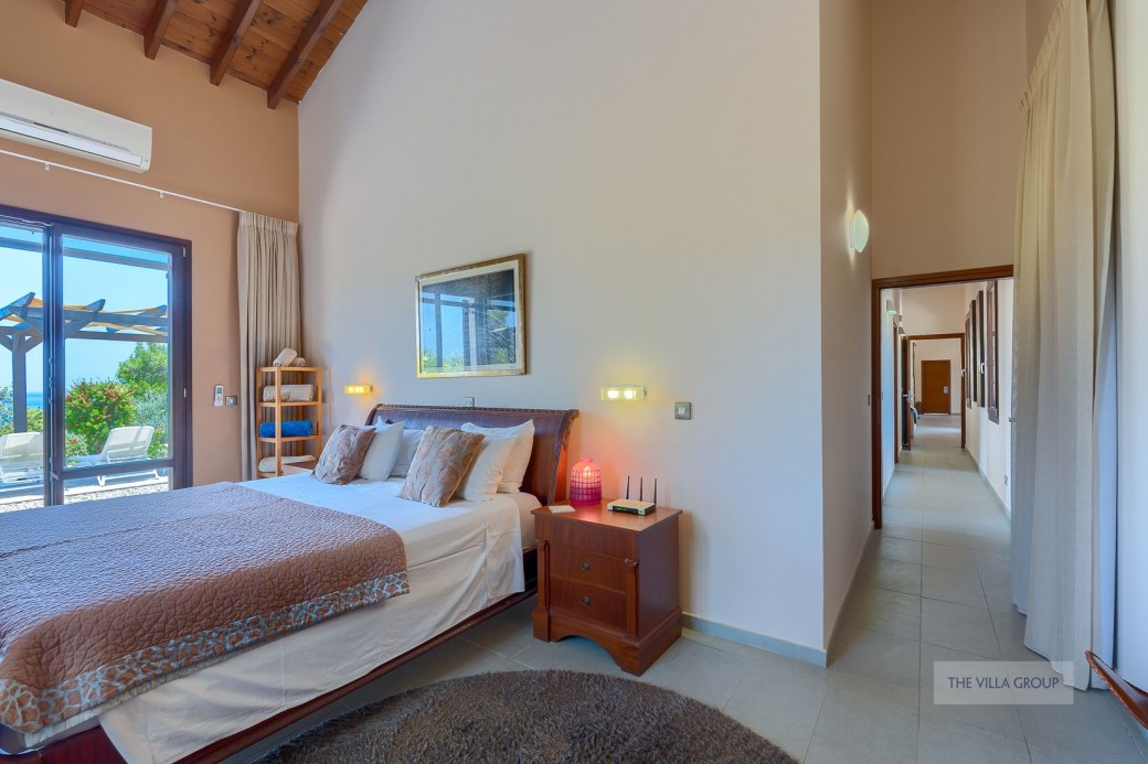A long corridor leading from the living area connects the three bedrooms
