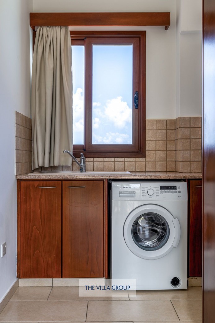First floor kitchenette with washing machine