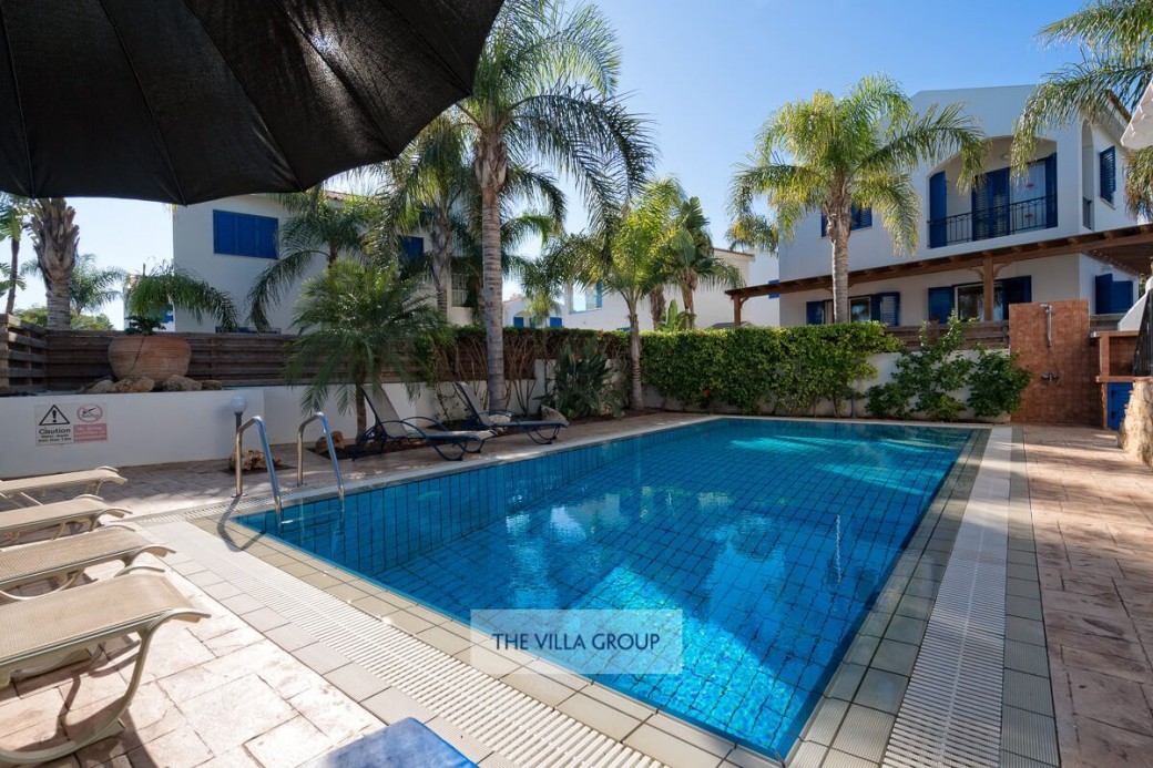 Sunbeds surround the swimming pool