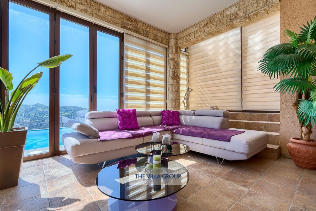 Conservatory furnished with comfortable sofas