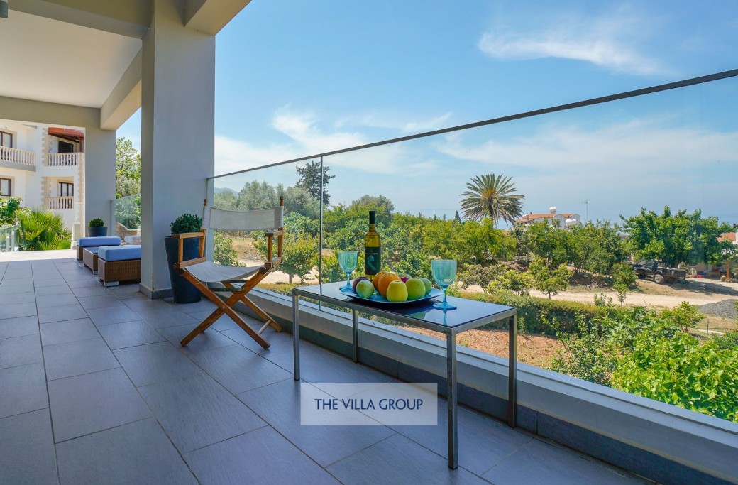 Full length terrace with plenty of outside furniture for relaxing and enjoying the stunning views