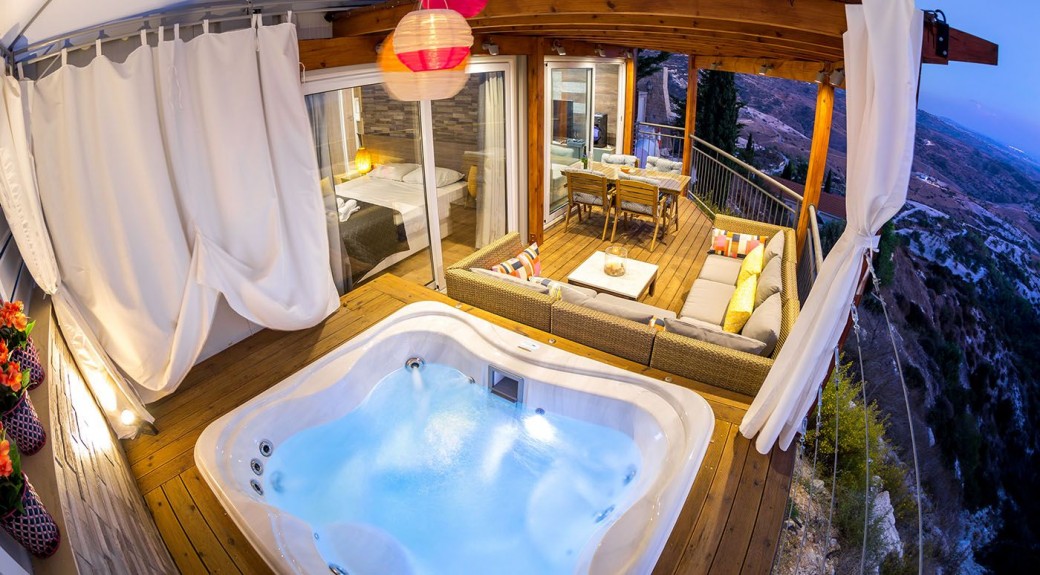 A private luxury space with seating and jacuzzi
