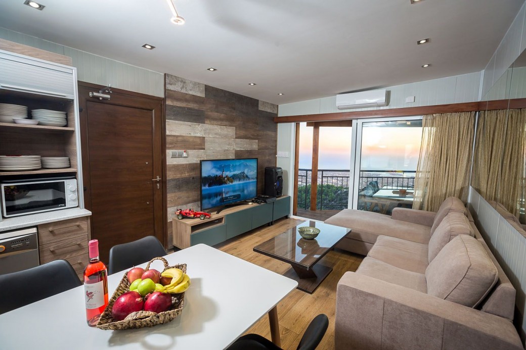 Living room with seating and TV