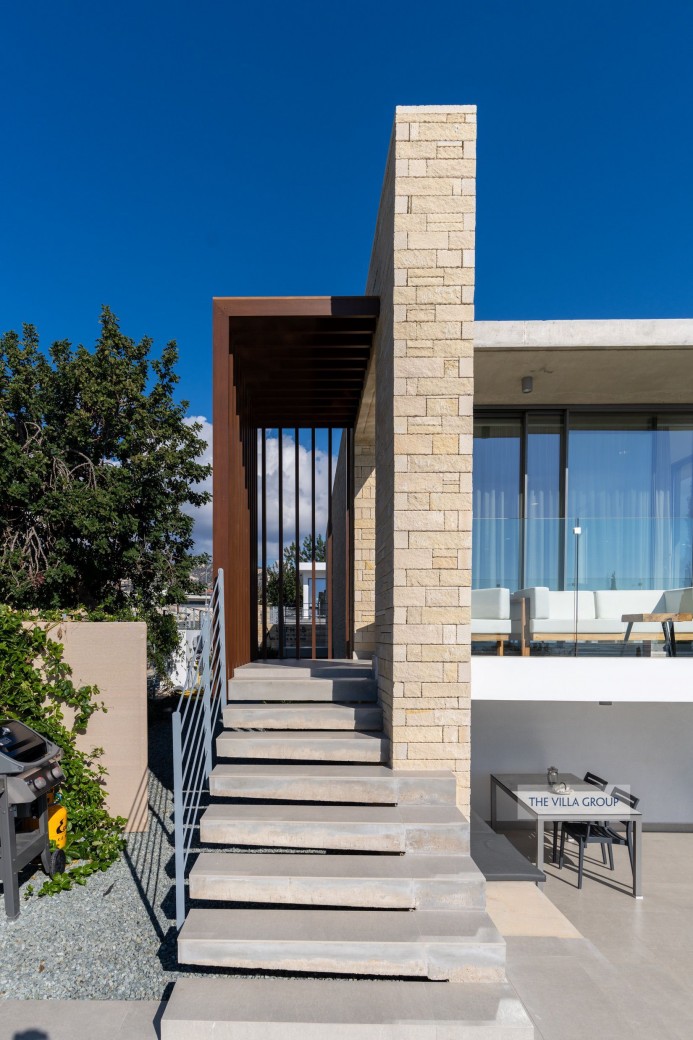 Stairs from the swimming pool to furnished terrace