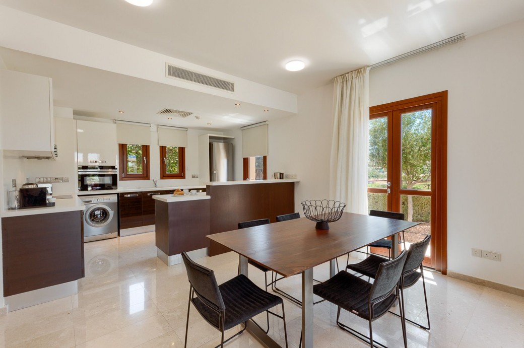 Dining area boasts a modern dining table and 6 chairs