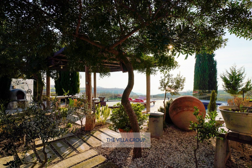 Various fruit trees and a small vegetable garden