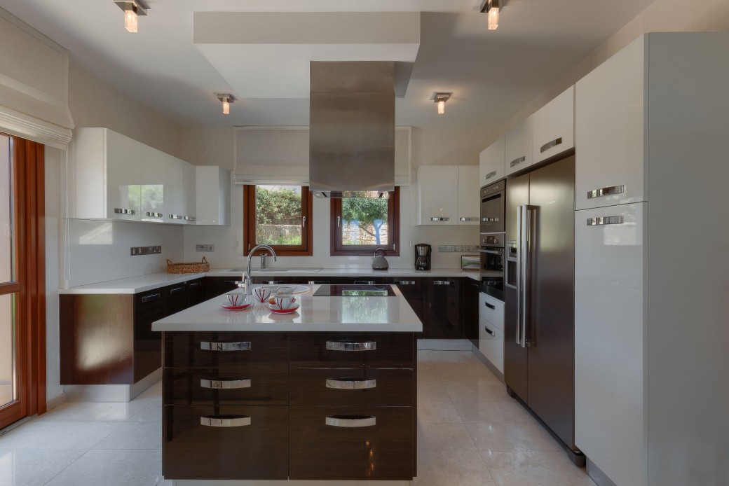 Modern kitchen separated by sliding glass doors 