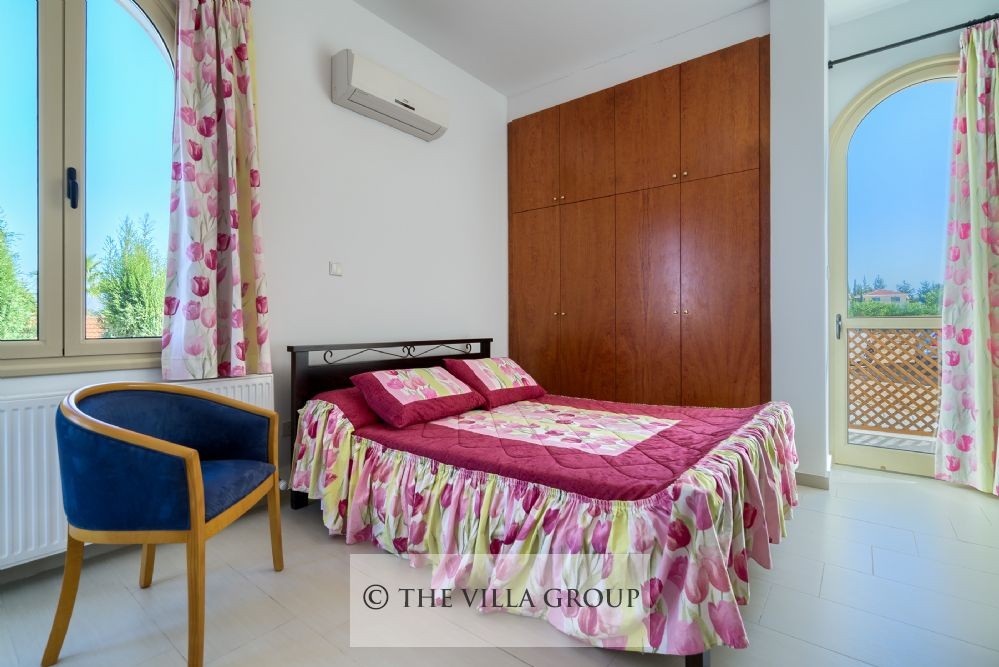 Double bedroom with doors leading to the terrace