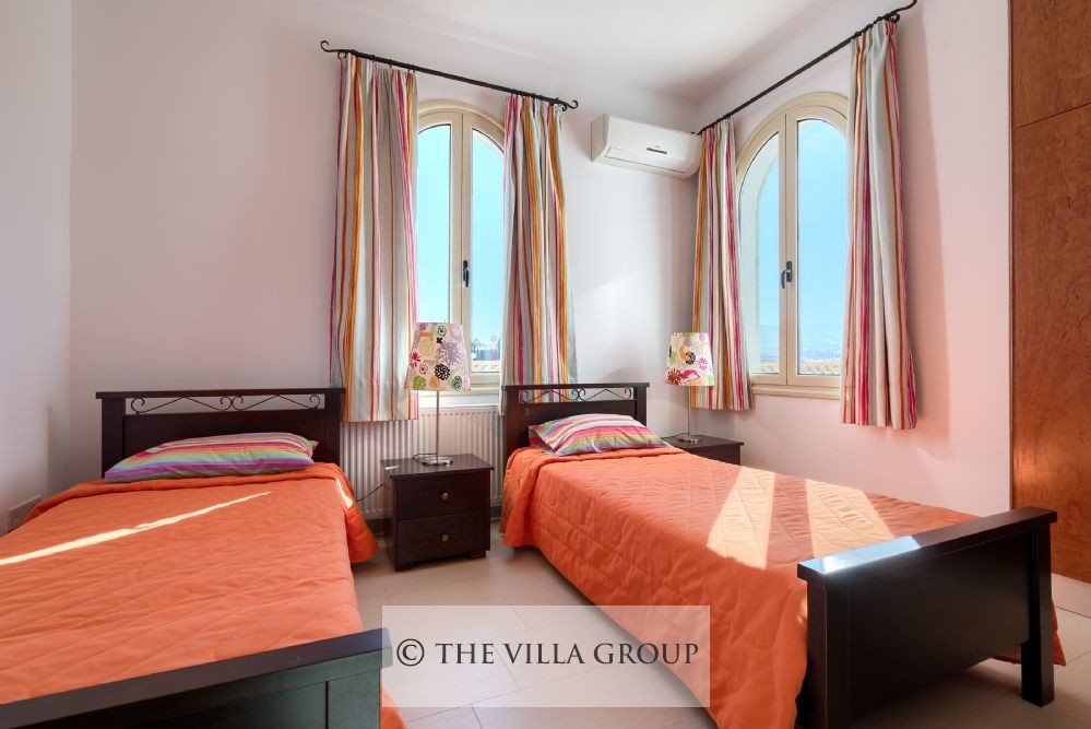 Twin bedroom decorated in bright cheerful colours