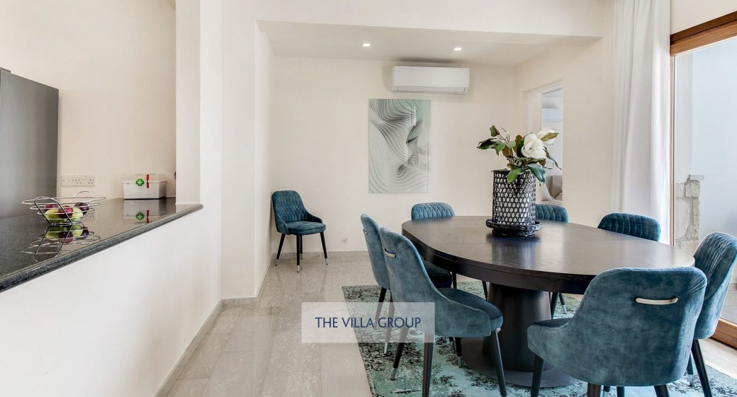 The villa is spread across three floors with a vaulted ceiling