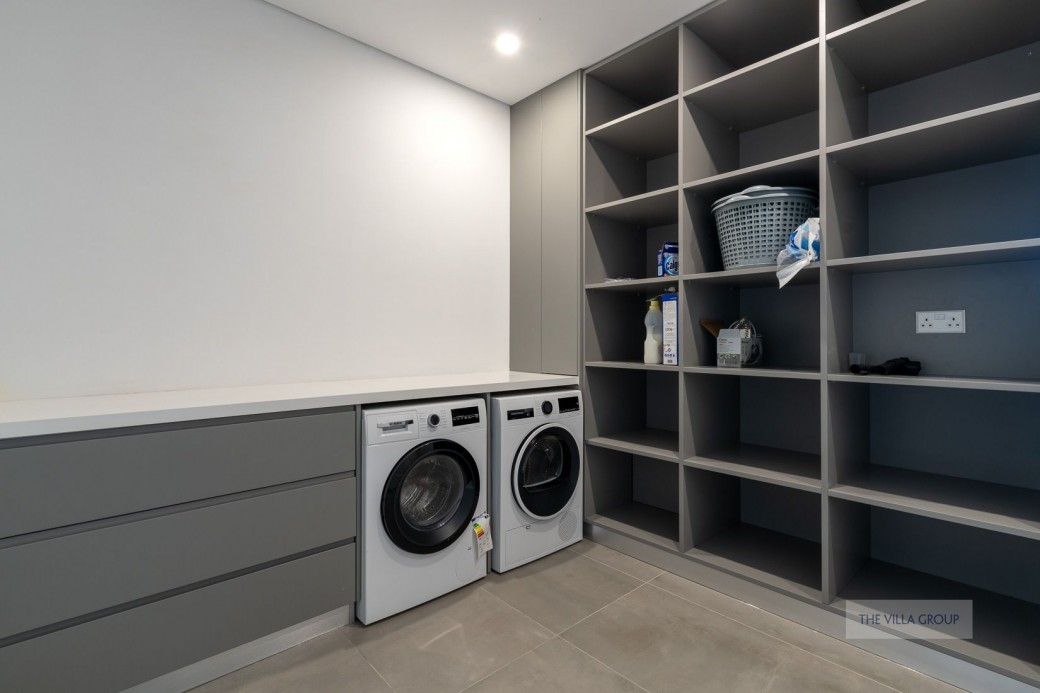 Utility room housing washing machine and dryer