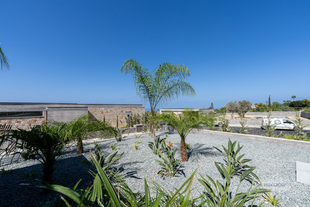 Landscaped gardens surround the villa