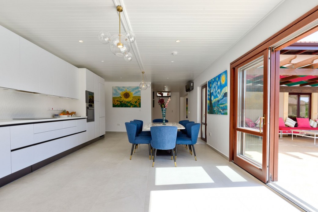Large patio doors that open out to and offer views of the outside pool area