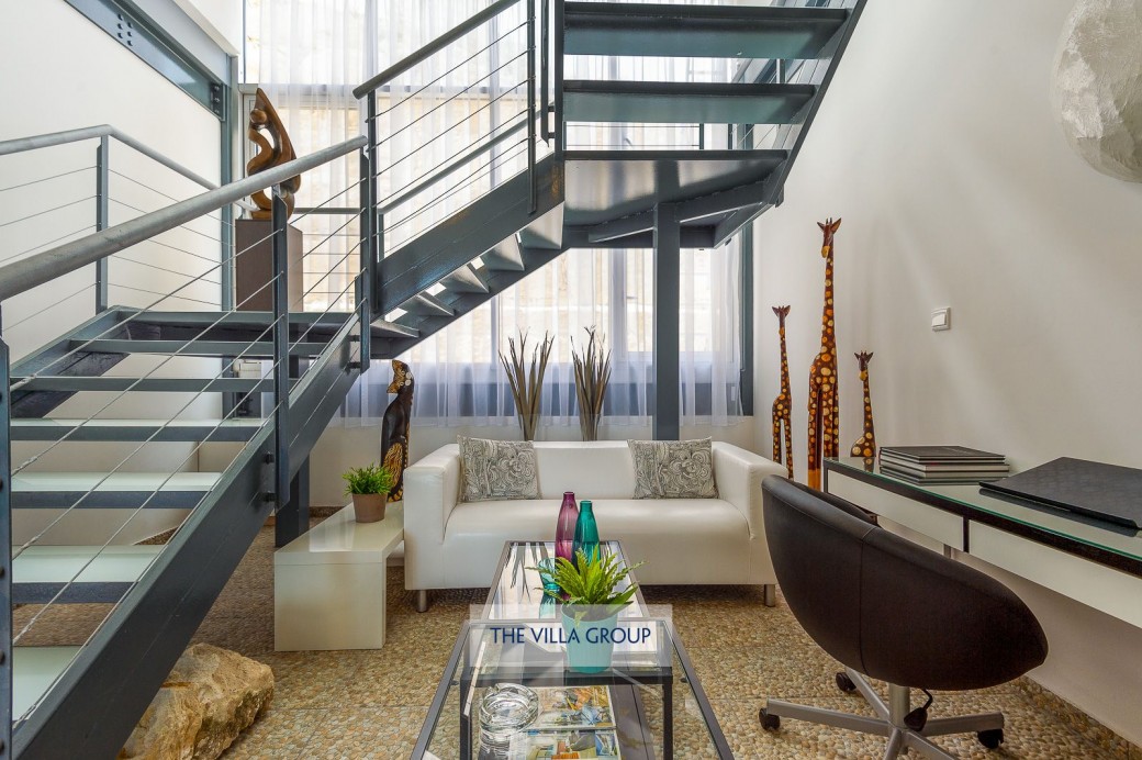 Elegant staircase covered with glazed atrium