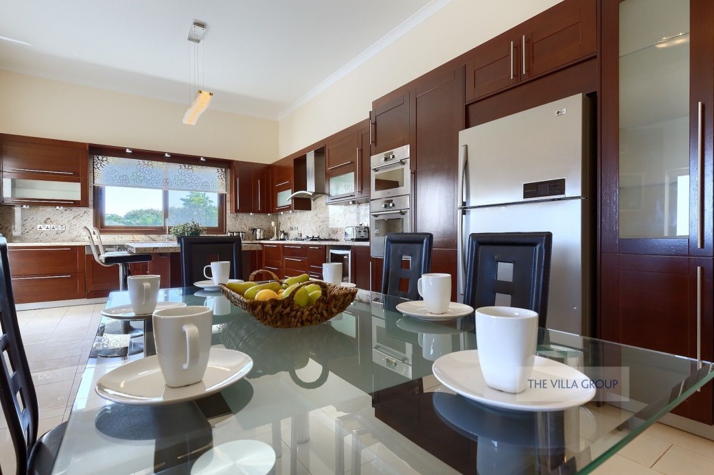Spacious kitchen equipped with modern appliances