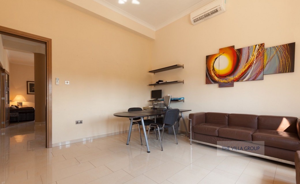 Games room with a television, games console and football table 