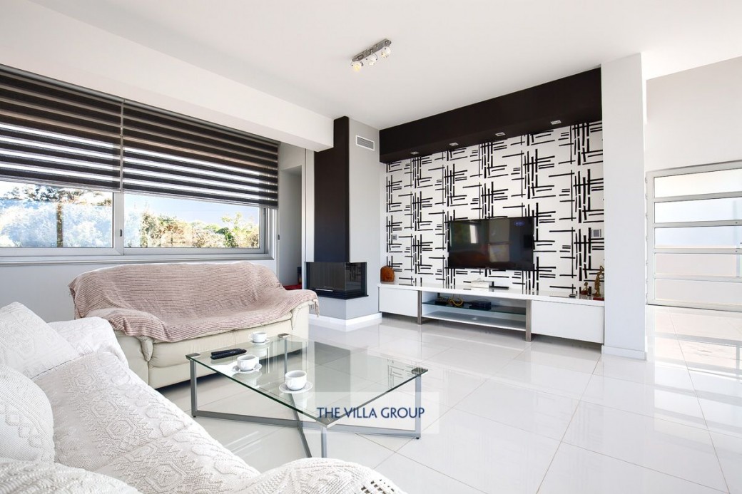 Open plan living room with flat screen tv