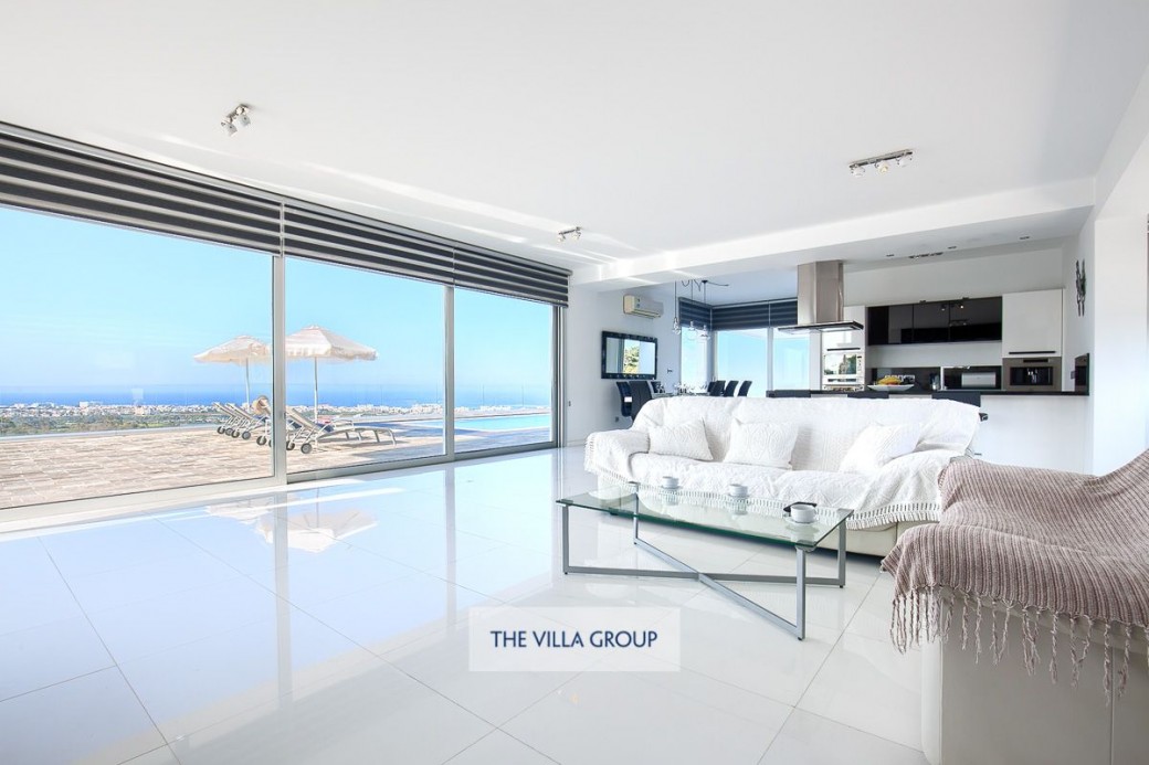 Comfortable open plan living area with plenty of sofas