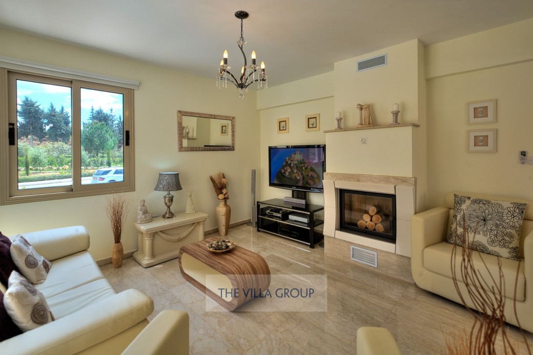 Open plan living area has a comfortable cream leather suite