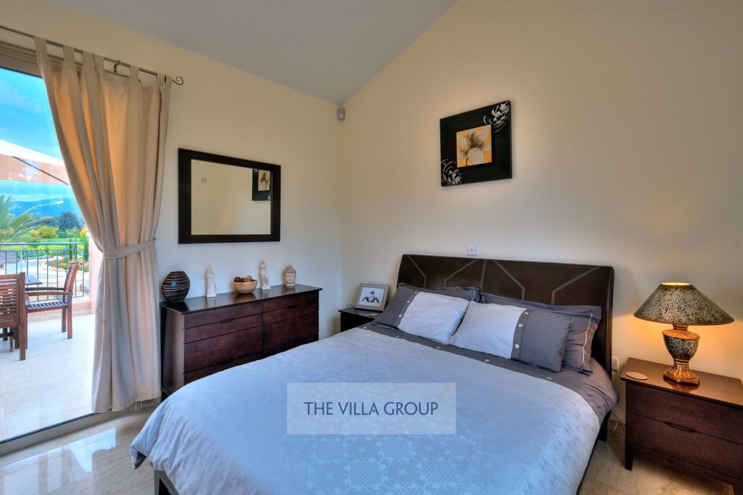 Patio doors lead to spacious shared balcony