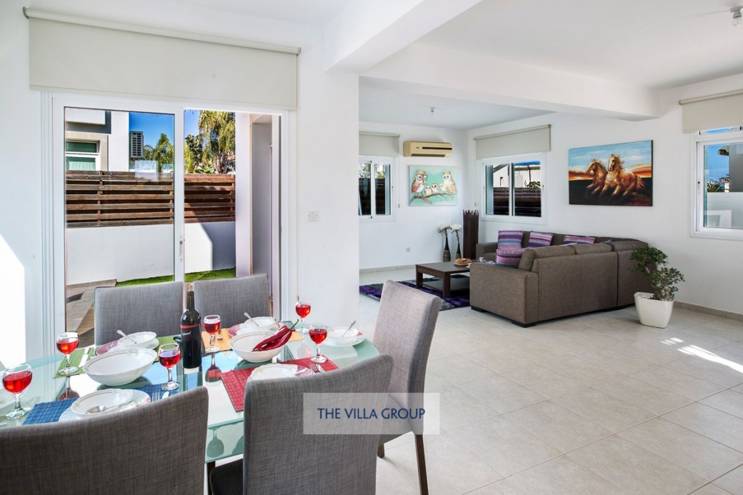 Patios doors lead to swimming pool and terrace area