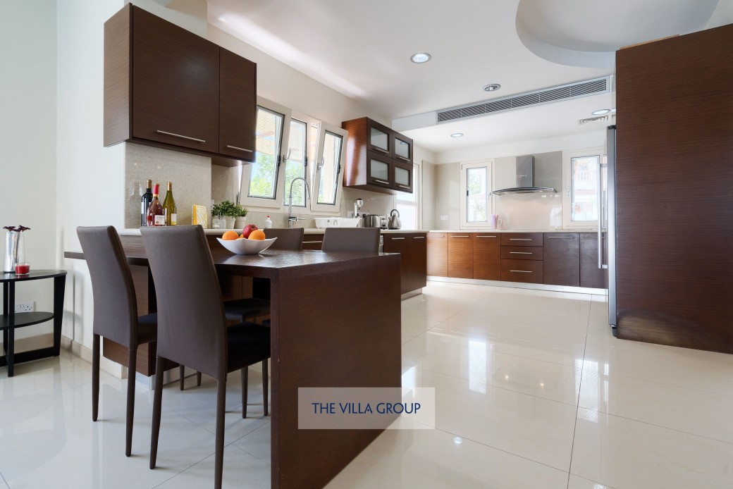 Modern fully equipped kitchen with breakfast table