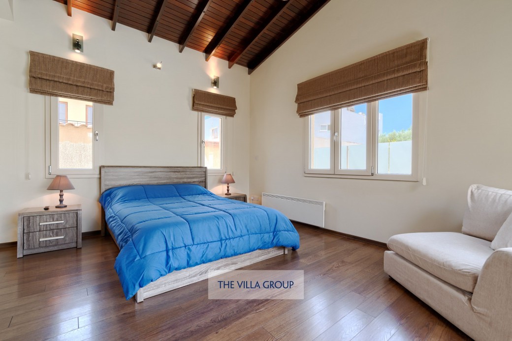 Master bedroom with beautiful beamed ceiling