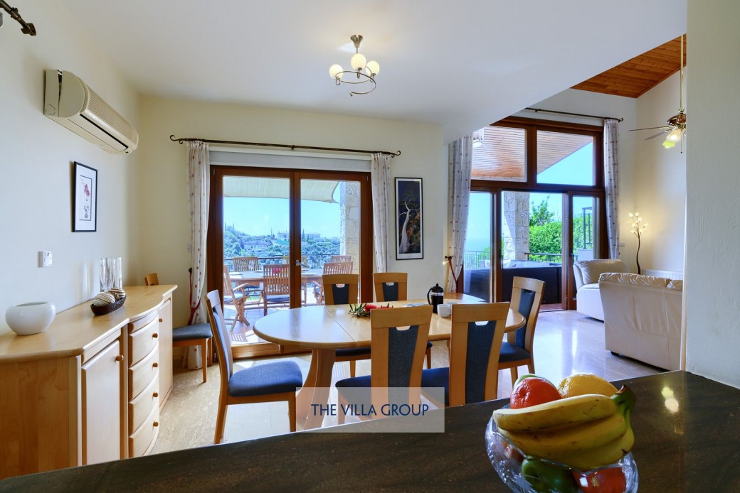 The dining area and living area feature large patio doors which open out to the large furnished terrace