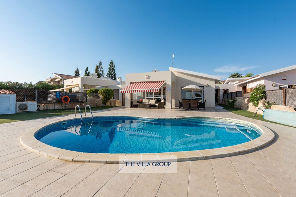 Private kidney shaped swimming pool with walk-in steps