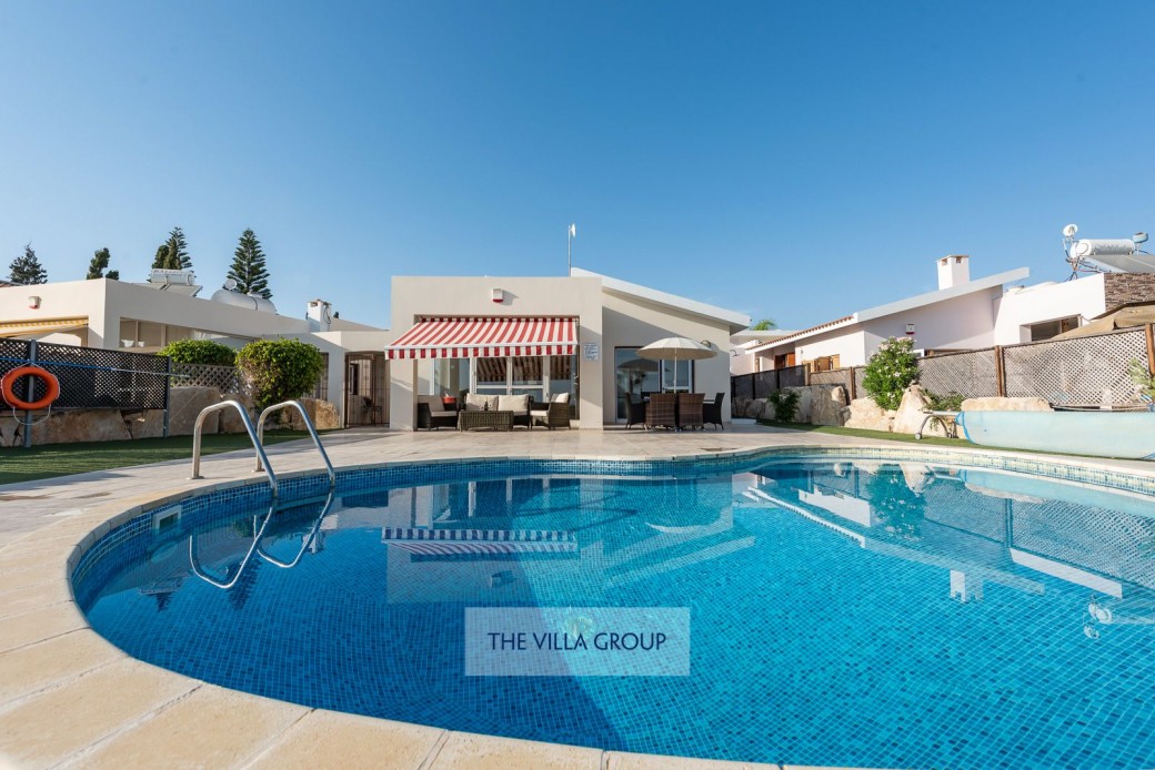 Private kidney shaped swimming pool with walk-in steps