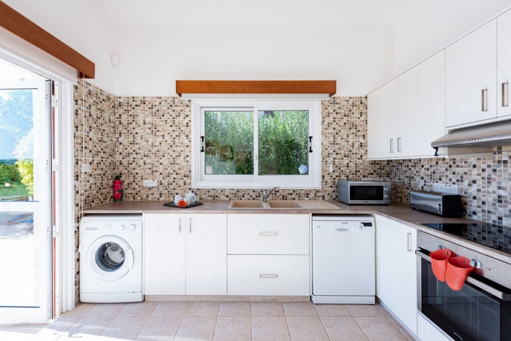 Patio doors from kitchen lead out to the terrace